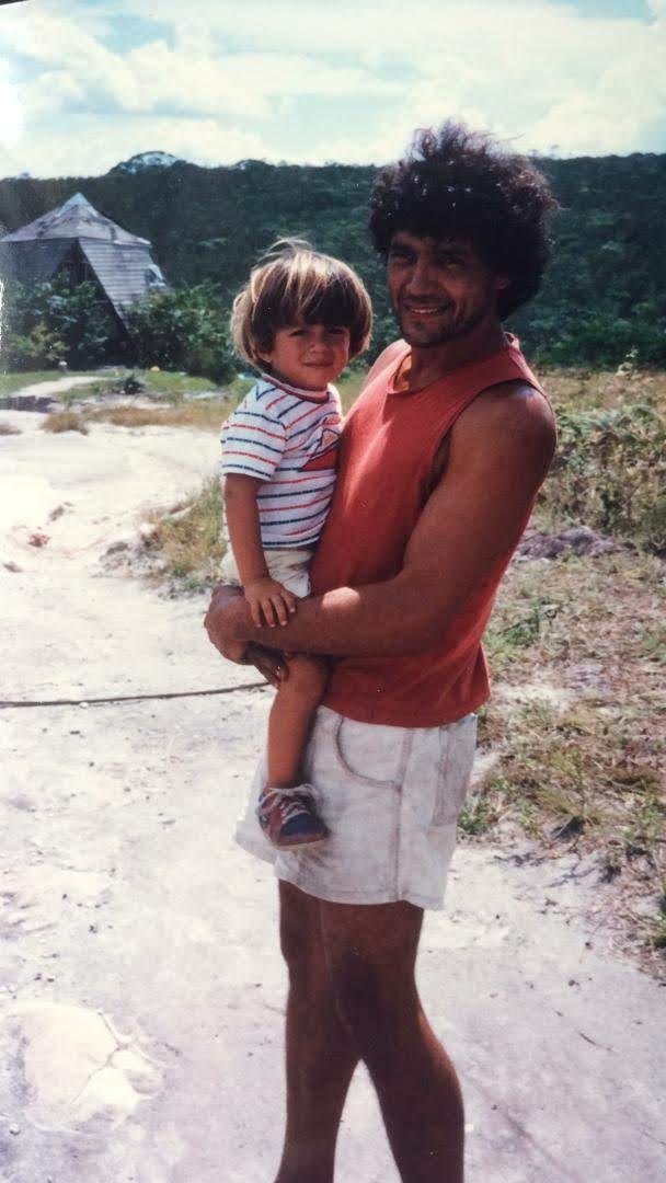 Ram as a small child, held by his father