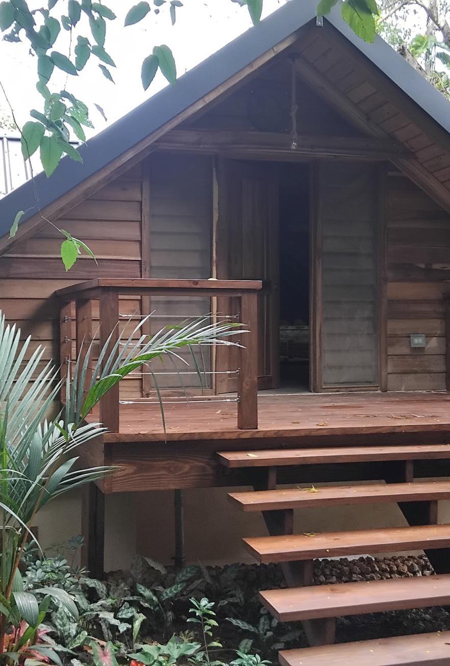 A timber cabin with a hardwood stair