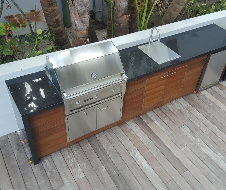 An outdoor kitchen run in hardwood and steel